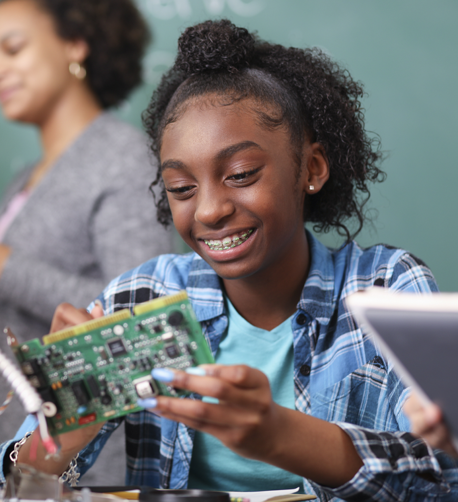 girl having fun with a circuit board