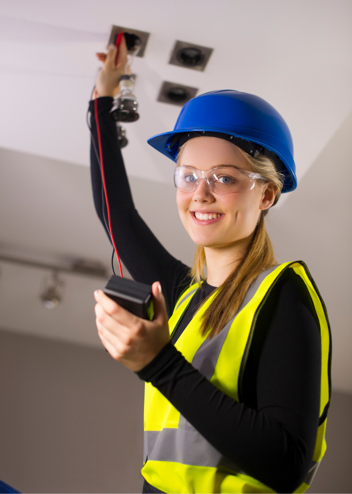 woman electrician testing voltage