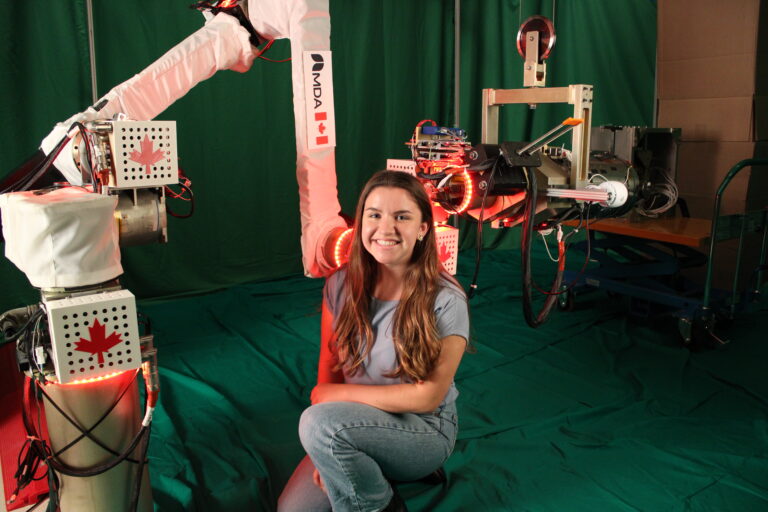 CAGIS role model Erin Richardson with robot