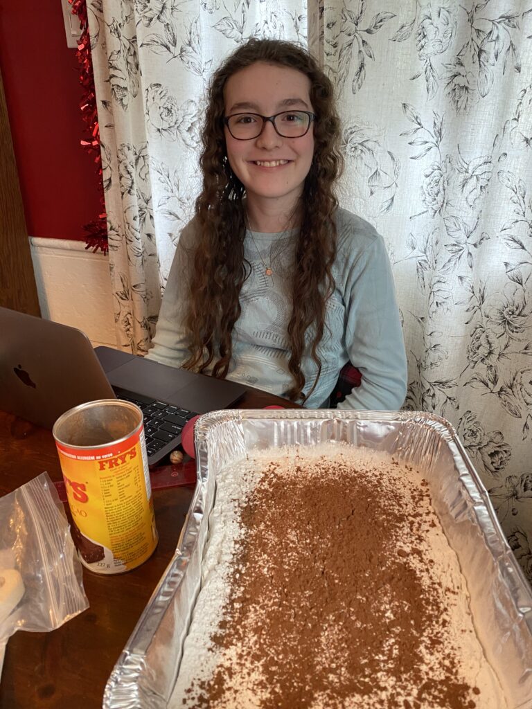 CAGIS member Clara Brown doing a fun, hands-on science experiment