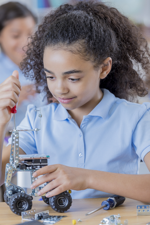 Girl learning about robotics by doing a fun, hands-on experiment