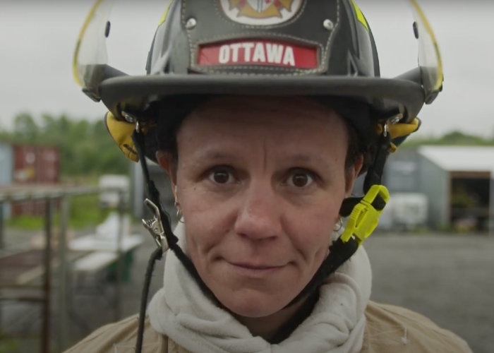 Cheryl Hunt with firefighter helmet